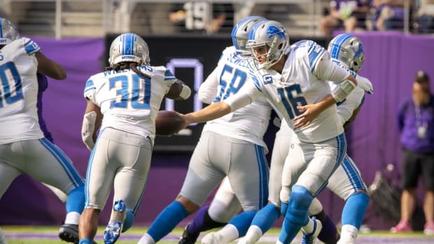 Oct 10, 2021; Minneapolis, Minnesota, USA; Detroit Lions running back Jamaal Williams (30) and quarterback Jared Goff (16) in action during the game between the Detroit Lions and the Minnesota Vikings at U.S. Bank Stadium. Mandatory Credit: Jerome Miron-USA TODAY Sports